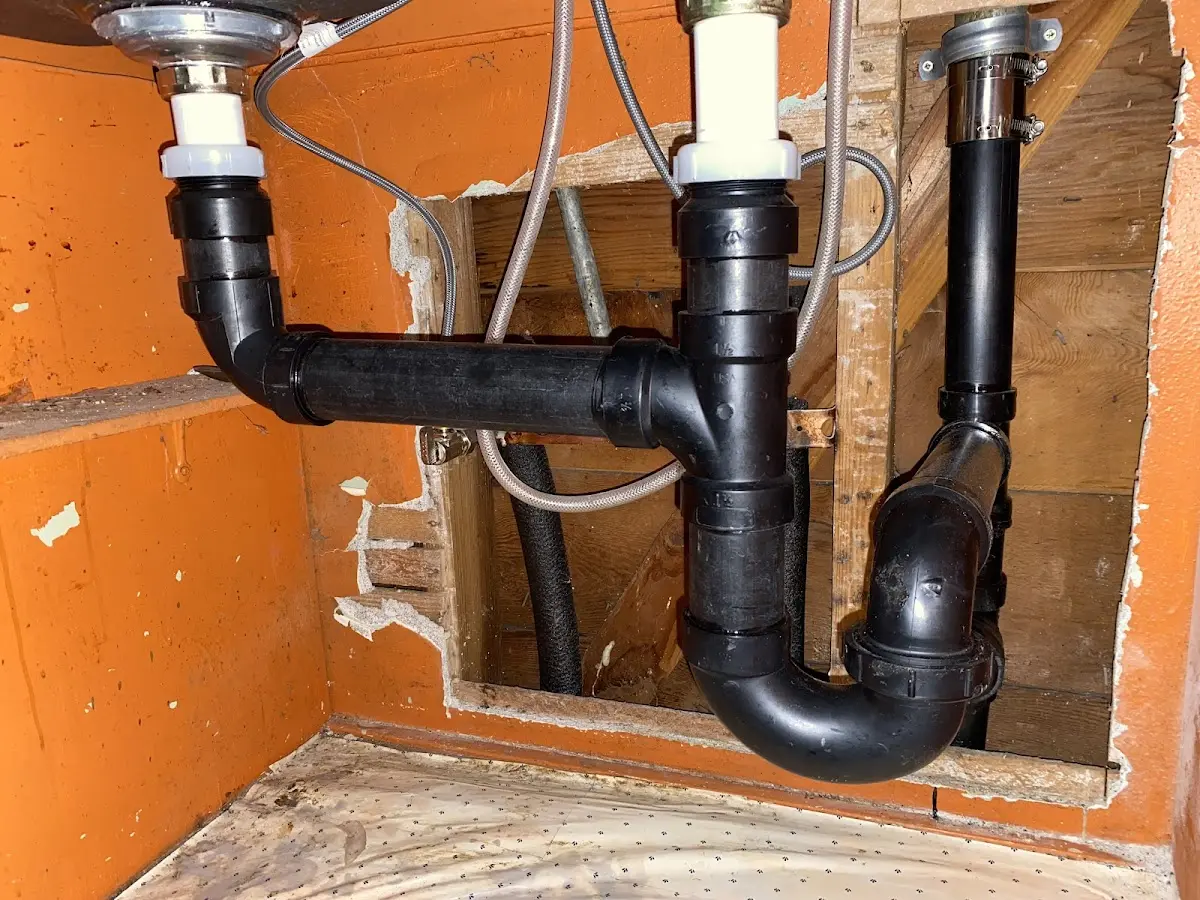 Professional Garbage Disposal Repair equipment and tools on the job in Leander